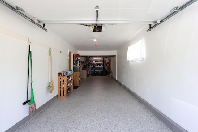 5081 Mengel Ln, Hilliard, OH 43026 - garage with a garage door opener and baseboards