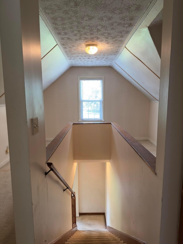 3660 Watt Rd, Columbus, OH 43230 - stairway featuring carpet floors, vaulted ceiling, and a textured ceiling