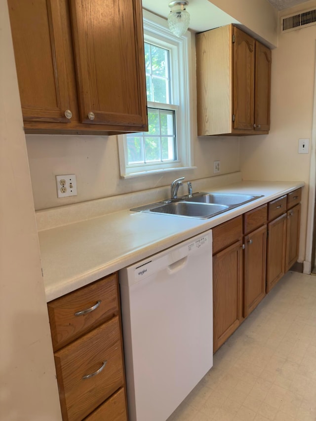 3660 Watt Rd, Columbus, OH 43230 - kitchen featuring dishwasher, light flooring, light countertops, and brown cabinets