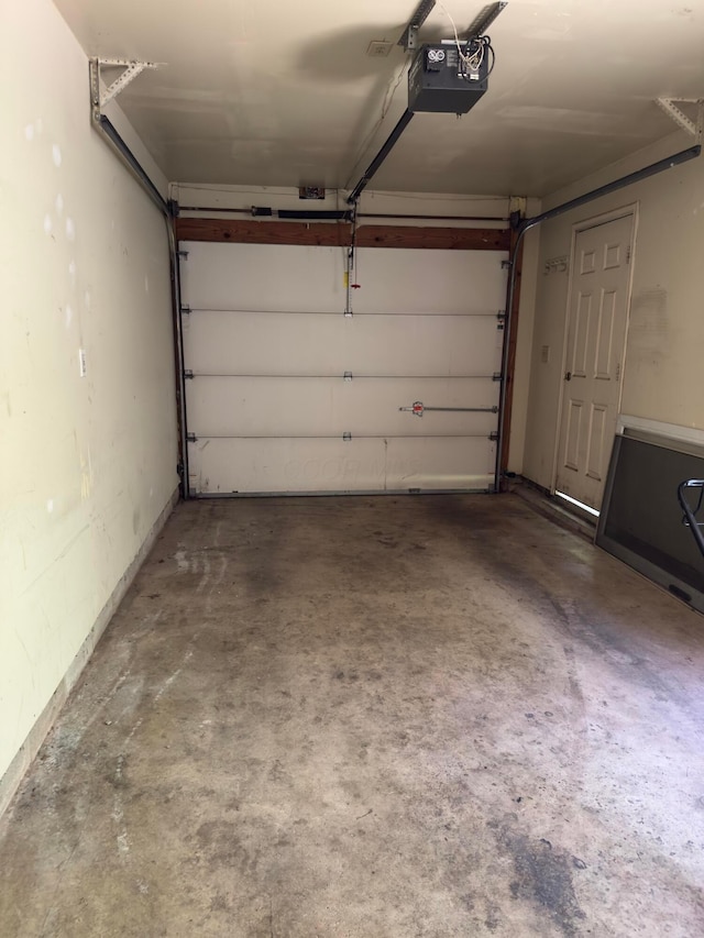 3660 Watt Rd, Columbus, OH 43230 - garage featuring a garage door opener