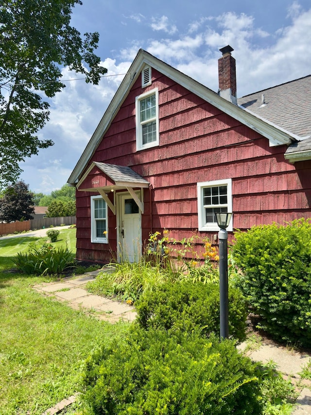 3660 Watt Rd, Columbus, OH 43230 - view of front of home with a chimney and roof with shingles