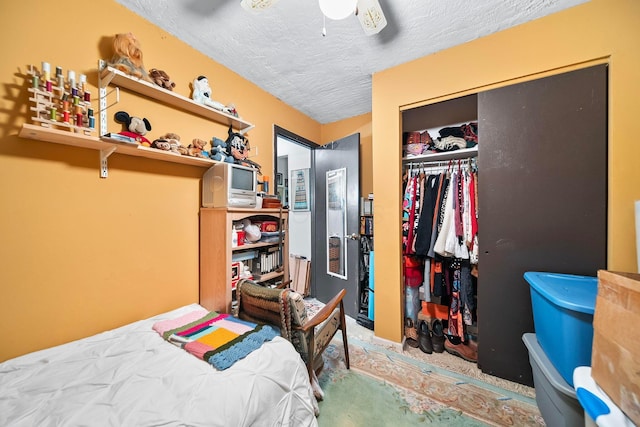 3750 Dresden St, Columbus, OH 43224 - bedroom featuring a textured ceiling, a closet, carpet flooring, and a ceiling fan