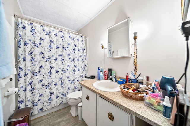 3750 Dresden St, Columbus, OH 43224 - bathroom featuring vanity, wood finished floors, a shower with curtain, ornamental molding, and a textured ceiling