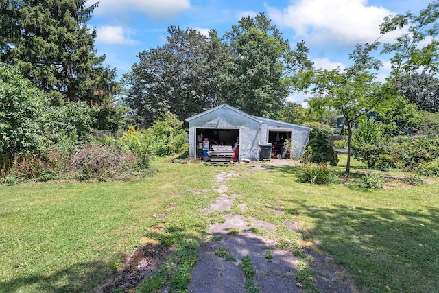 3750 Dresden St, Columbus, OH 43224 - view of grassy yard with an outdoor structure and an outbuilding