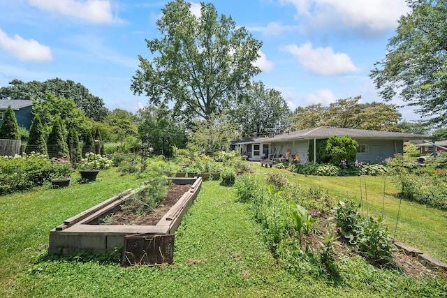 3750 Dresden St, Columbus, OH 43224 - view of grassy yard featuring a vegetable garden