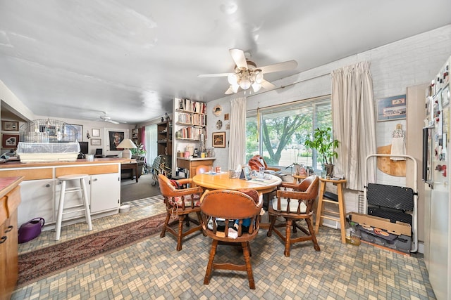 3750 Dresden St, Columbus, OH 43224 - dining area featuring ceiling fan, an office area, and brick patterned floors