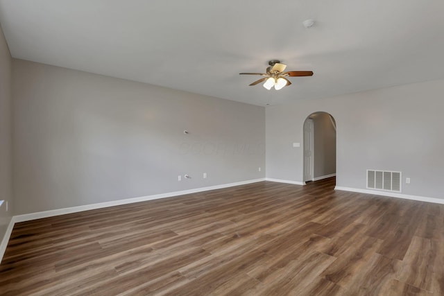 5512 Old Coble St, Canal Winchester, OH 43110 - spare room with arched walkways, a ceiling fan, and dark wood finished floors