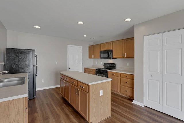5512 Old Coble St, Canal Winchester, OH 43110 - kitchen featuring black appliances, a kitchen island, light countertops, dark wood-type flooring, and recessed lighting