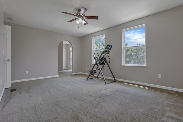 5512 Old Coble St, Canal Winchester, OH 43110 - workout room featuring arched walkways, ceiling fan, and carpet flooring