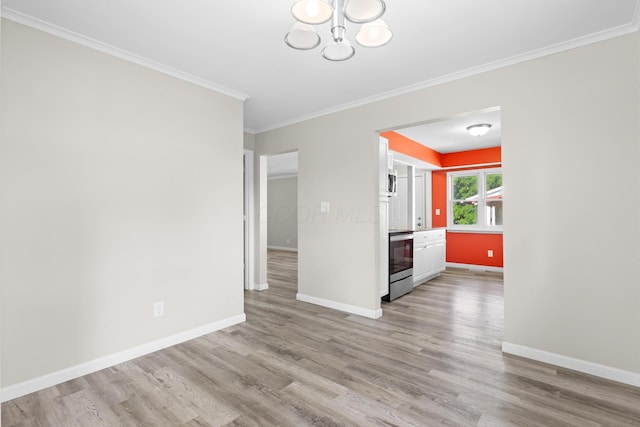 3851 Security Dr, Grove City, OH 43123 - spare room featuring ornamental molding, light wood-type flooring, and a chandelier