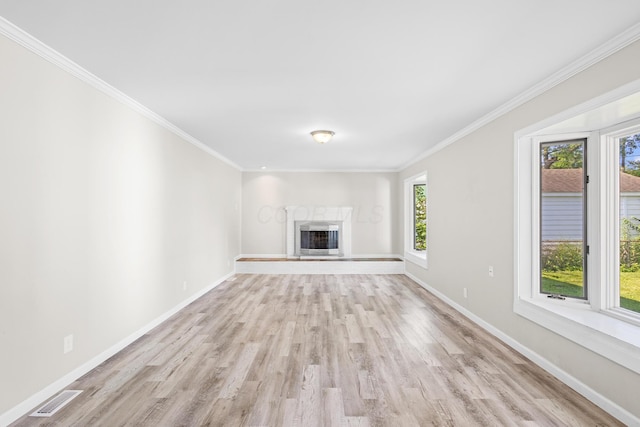 3851 Security Dr, Grove City, OH 43123 - unfurnished living room with light wood-type flooring, plenty of natural light, a high end fireplace, and ornamental molding