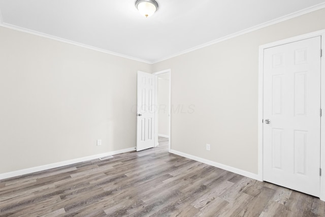 3851 Security Dr, Grove City, OH 43123 - unfurnished bedroom with wood finished floors and ornamental molding