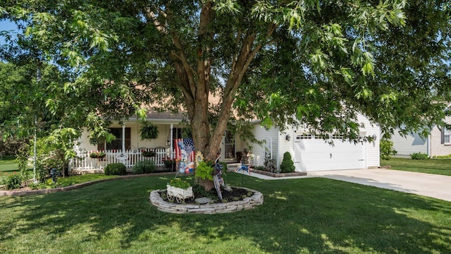 405 Meadowland Dr, Newark, OH 43055 - obstructed view of property featuring concrete driveway, an attached garage, a front yard, and covered porch