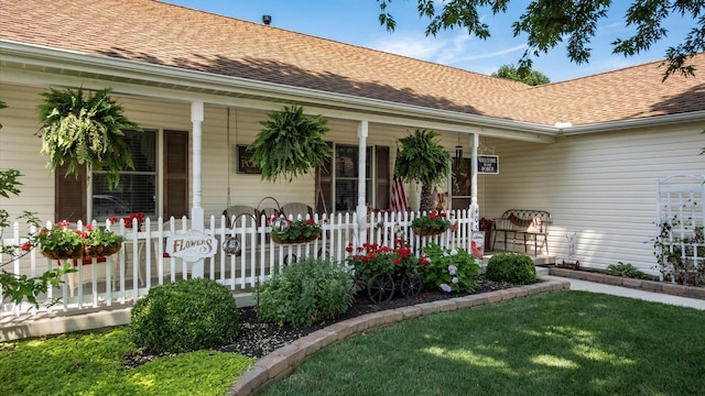 405 Meadowland Dr, Newark, OH 43055 - entrance to property featuring covered porch, roof with shingles, and a lawn