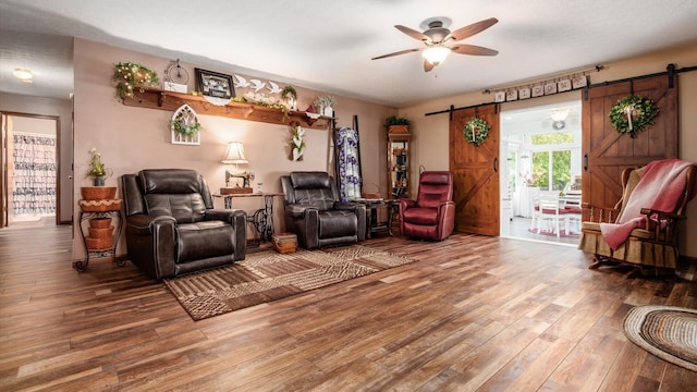 405 Meadowland Dr, Newark, OH 43055 - living area with a barn door, wood finished floors, and a ceiling fan
