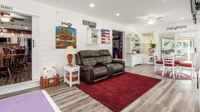 405 Meadowland Dr, Newark, OH 43055 - living room featuring a ceiling fan, light wood finished floors, recessed lighting, and wooden walls