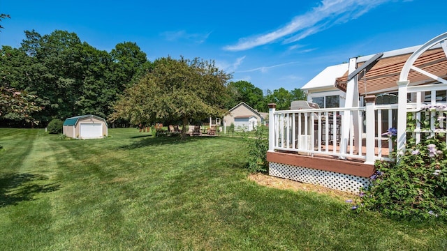 405 Meadowland Dr, Newark, OH 43055 - view of grassy yard with a wooden deck and a storage shed