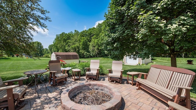 405 Meadowland Dr, Newark, OH 43055 - view of patio featuring a storage shed and an outdoor fire pit
