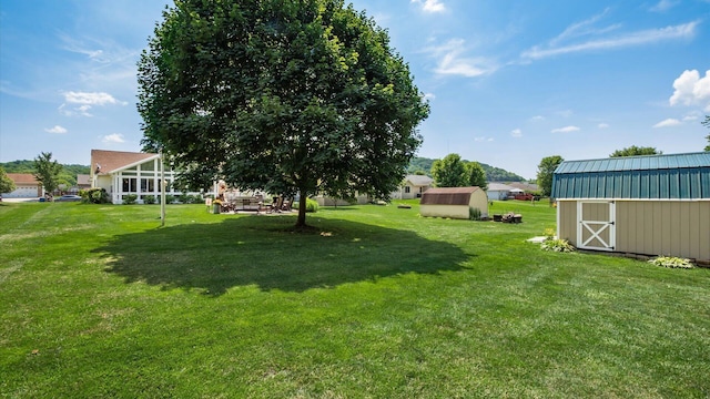405 Meadowland Dr, Newark, OH 43055 - view of green lawn featuring a storage shed