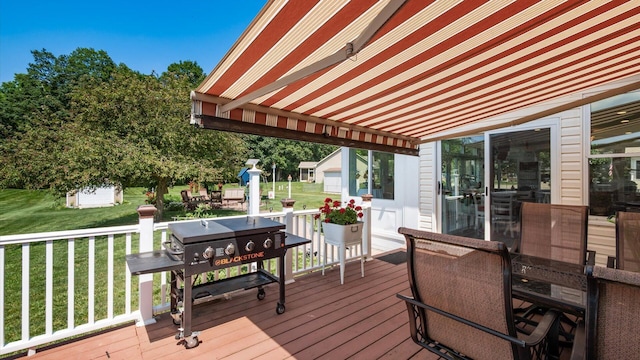 405 Meadowland Dr, Newark, OH 43055 - wooden deck with a lawn, area for grilling, and an outdoor structure