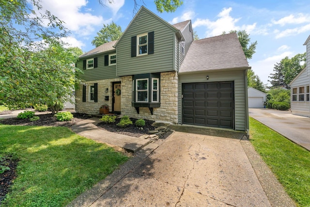 67 Aldrich Rd, Columbus, OH 43214 - view of front of house featuring stone siding, roof with shingles, driveway, and an attached garage