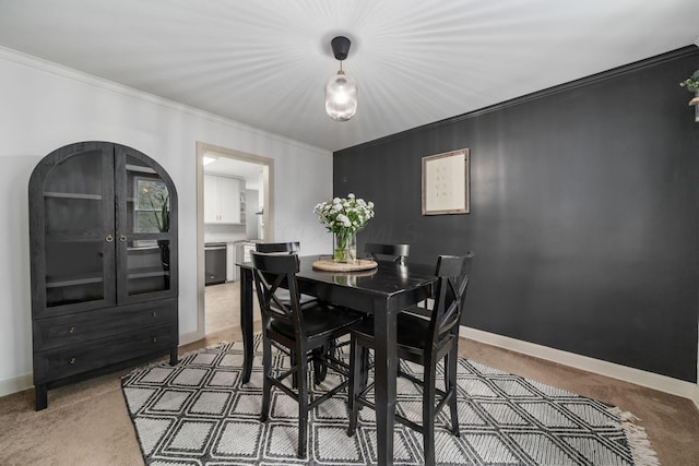 67 Aldrich Rd, Columbus, OH 43214 - dining space featuring light colored carpet, crown molding, and arched walkways