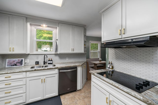67 Aldrich Rd, Columbus, OH 43214 - kitchen with dishwasher, under cabinet range hood, black electric cooktop, and tasteful backsplash