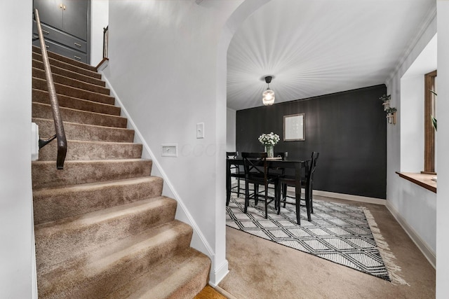 67 Aldrich Rd, Columbus, OH 43214 - stairway featuring carpet and arched walkways
