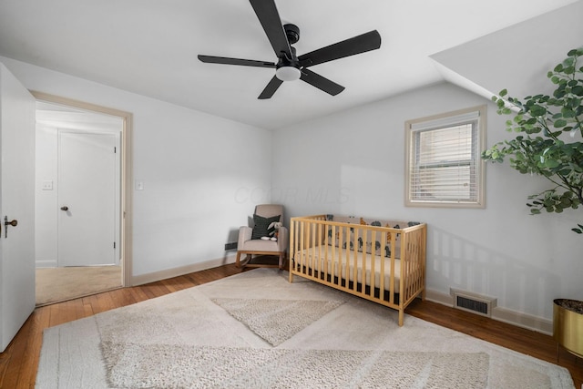 67 Aldrich Rd, Columbus, OH 43214 - bedroom featuring wood finished floors, vaulted ceiling, a nursery area, and ceiling fan
