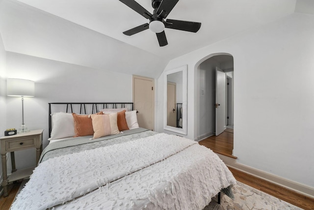 67 Aldrich Rd, Columbus, OH 43214 - bedroom with arched walkways, vaulted ceiling, wood finished floors, and ceiling fan