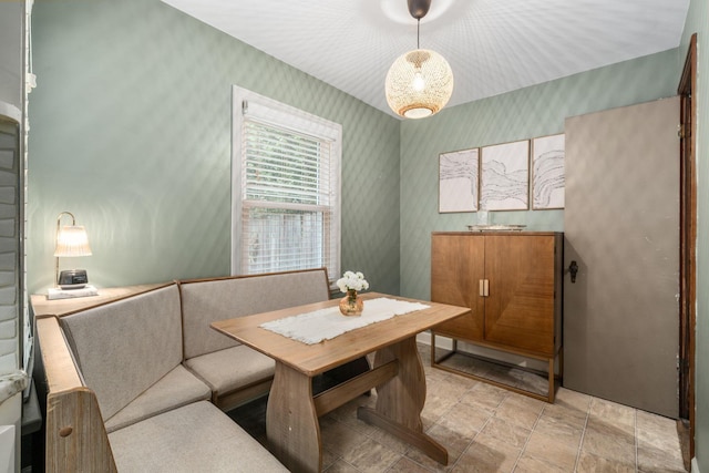 67 Aldrich Rd, Columbus, OH 43214 - dining space with wallpapered walls and light stone finish flooring