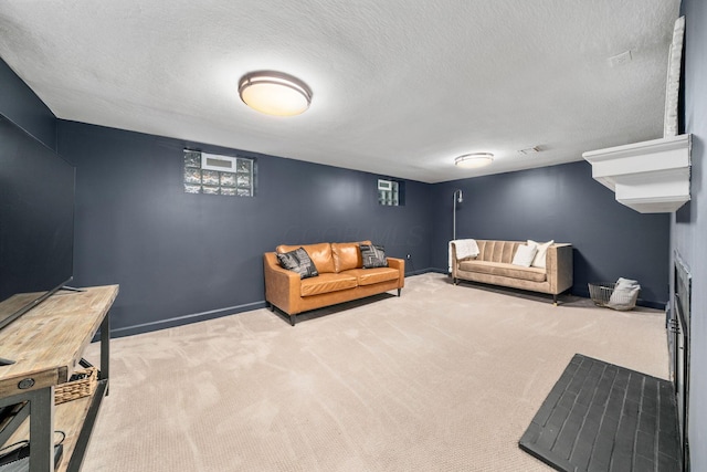 67 Aldrich Rd, Columbus, OH 43214 - carpeted living room featuring a textured ceiling and baseboards