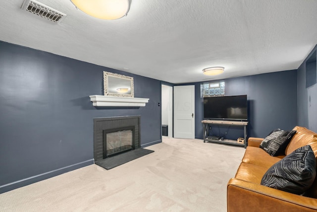 67 Aldrich Rd, Columbus, OH 43214 - carpeted living room featuring a glass covered fireplace and a textured ceiling