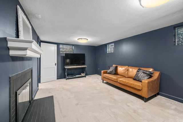 67 Aldrich Rd, Columbus, OH 43214 - carpeted living area with a fireplace and a textured ceiling
