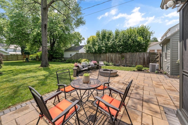 67 Aldrich Rd, Columbus, OH 43214 - fenced backyard featuring a patio and a fire pit