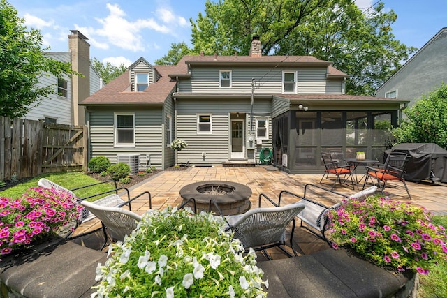 67 Aldrich Rd, Columbus, OH 43214 - back of house with an outdoor fire pit, a sunroom, a patio area, roof with shingles, and a chimney