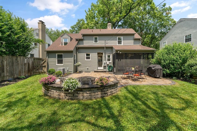 67 Aldrich Rd, Columbus, OH 43214 - rear view of house with an outdoor fire pit, a patio area, a sunroom, roof with shingles, and a chimney