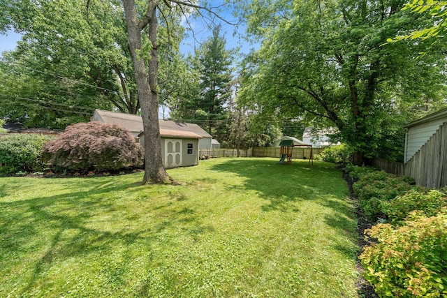 67 Aldrich Rd, Columbus, OH 43214 - fenced backyard with a playground and a shed