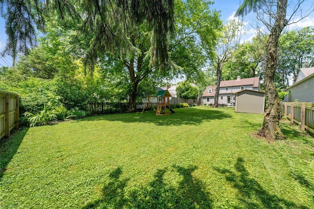 67 Aldrich Rd, Columbus, OH 43214 - fenced backyard featuring a playground and a shed