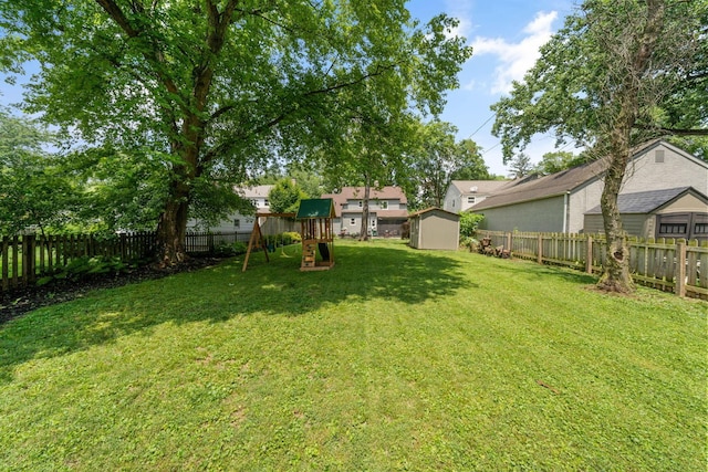 67 Aldrich Rd, Columbus, OH 43214 - fenced backyard featuring a playground and a storage shed