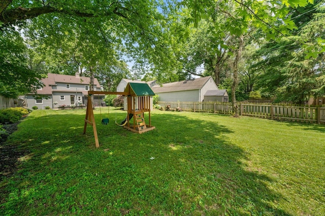 67 Aldrich Rd, Columbus, OH 43214 - fenced backyard featuring a playground