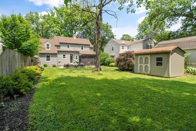 67 Aldrich Rd, Columbus, OH 43214 - view of yard with a storage shed and a sunroom