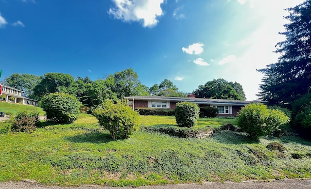 108 Terrace Ct, Lancaster, OH 43130 - view of front facade featuring a chimney and brick siding