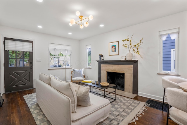 287 S Roys Ave, Columbus, OH 43204 - living room with wood finished floors, a premium fireplace, a chandelier, and recessed lighting