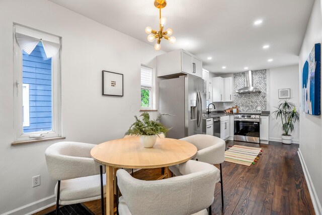 287 S Roys Ave, Columbus, OH 43204 - dining area with dark wood-style floors, a chandelier, and recessed lighting