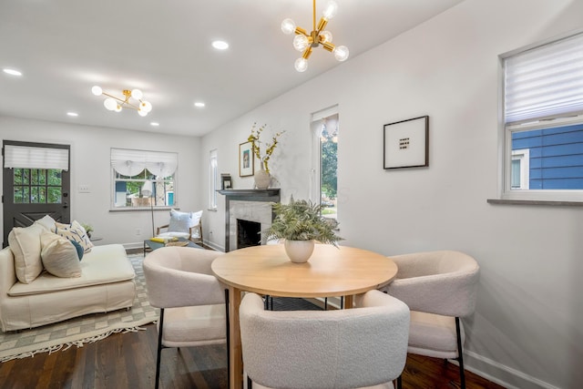 287 S Roys Ave, Columbus, OH 43204 - living room featuring a chandelier, wood finished floors, healthy amount of natural light, a fireplace, and recessed lighting