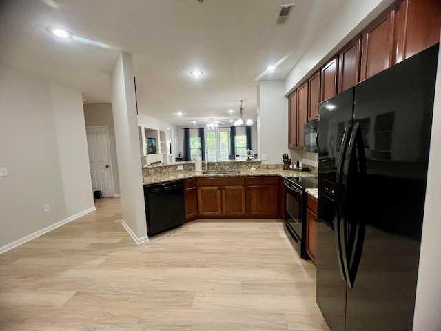 6090 Sowerby Ln, Westerville, OH 43081 - kitchen featuring black appliances, ceiling fan, light stone countertops, recessed lighting, and a peninsula