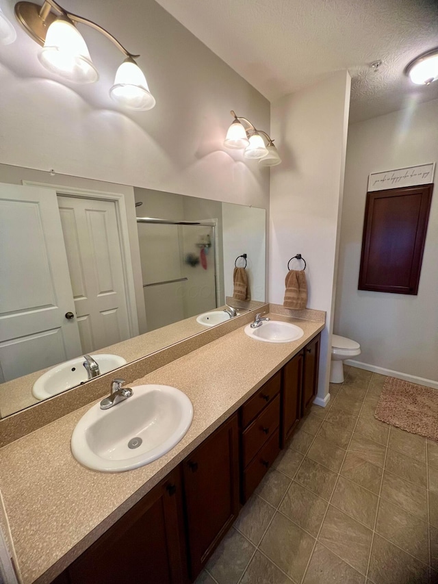 6090 Sowerby Ln, Westerville, OH 43081 - bathroom featuring a stall shower, double vanity, and tile patterned flooring