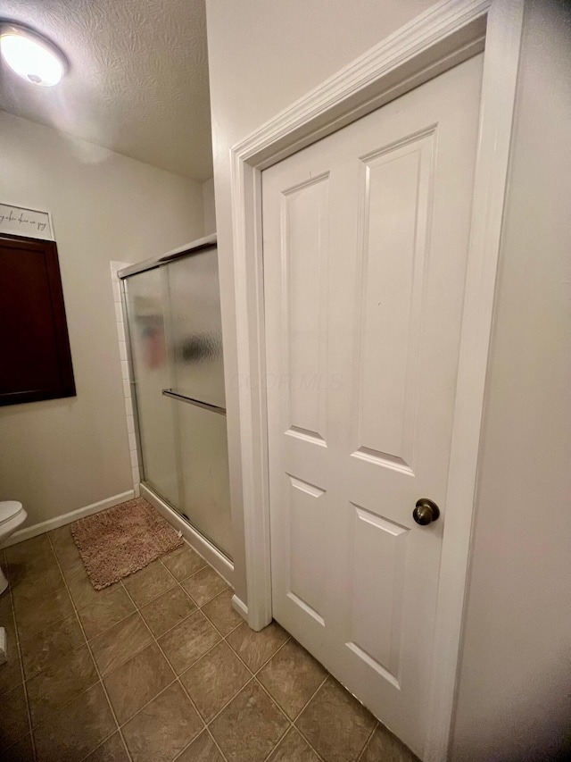 6090 Sowerby Ln, Westerville, OH 43081 - full bath featuring a stall shower, a textured ceiling, and tile patterned flooring