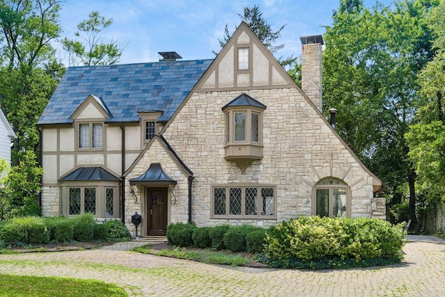 233 S Dawson Ave, Columbus, OH 43209 - tudor home with stucco siding, a chimney, and stone siding